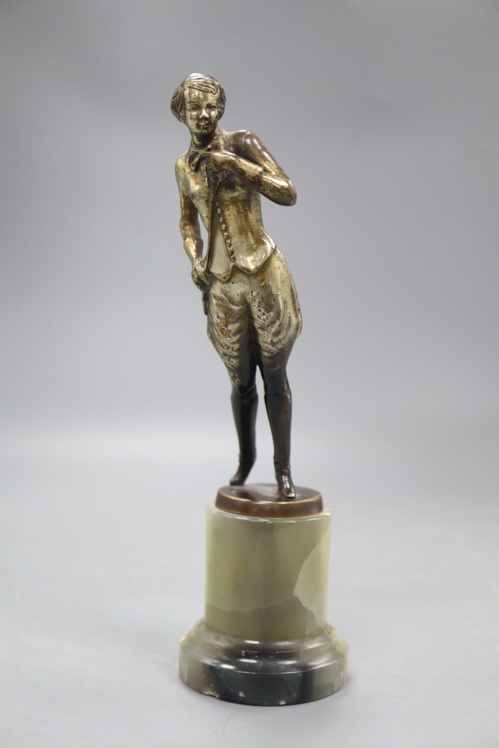 An Art Deco model of a horserider, on onyx base, height 19cm